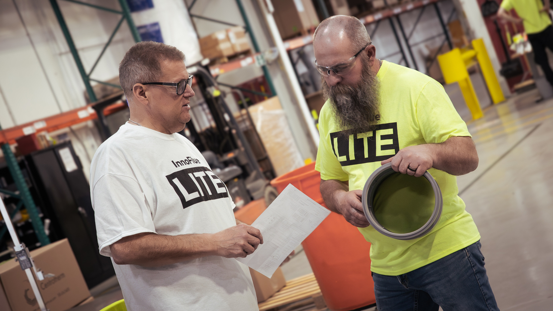 two men reviewing innoflue pp
