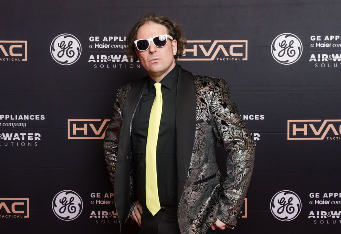 Picture of Matt Pryce with green tie and sunglasses 