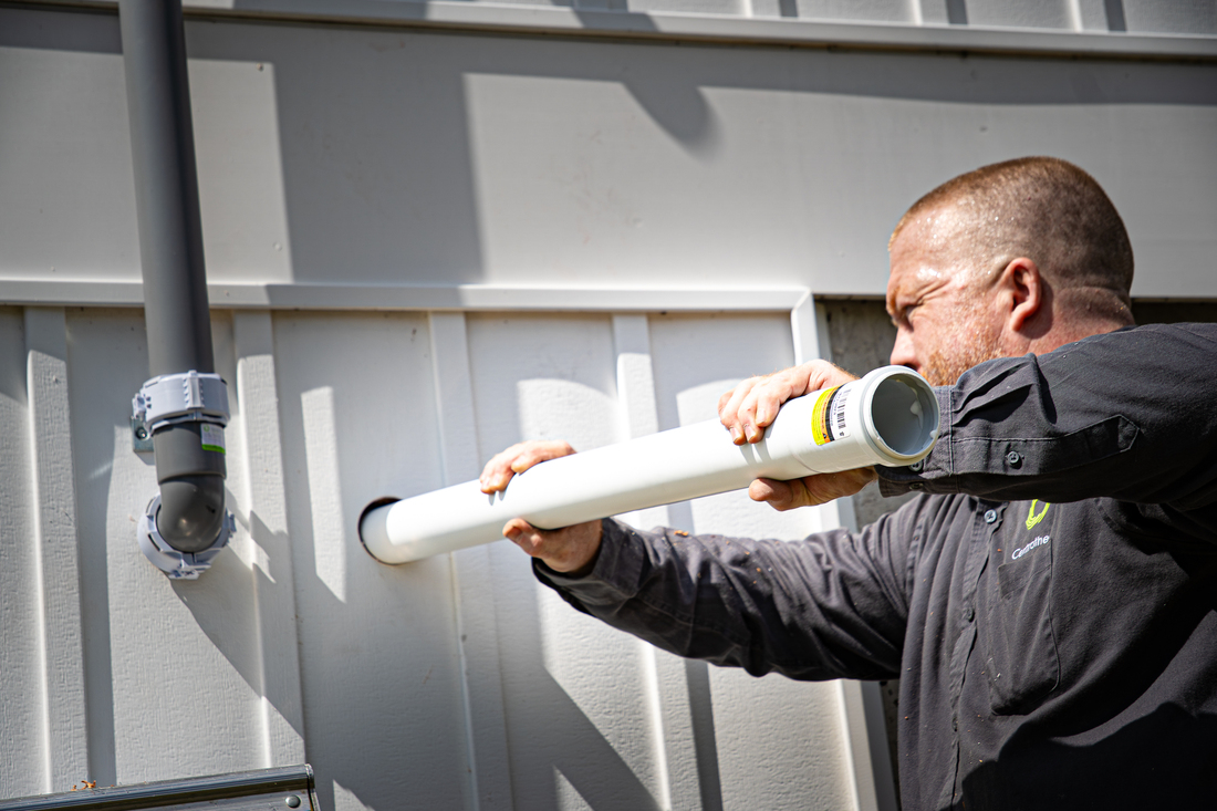 Close-up of a worker tightening innoflue lite
